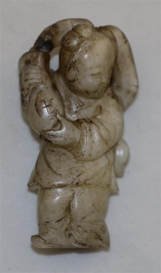 A Chinese white and black jade figure of a boy, 18th / 19th century, 5.8cm